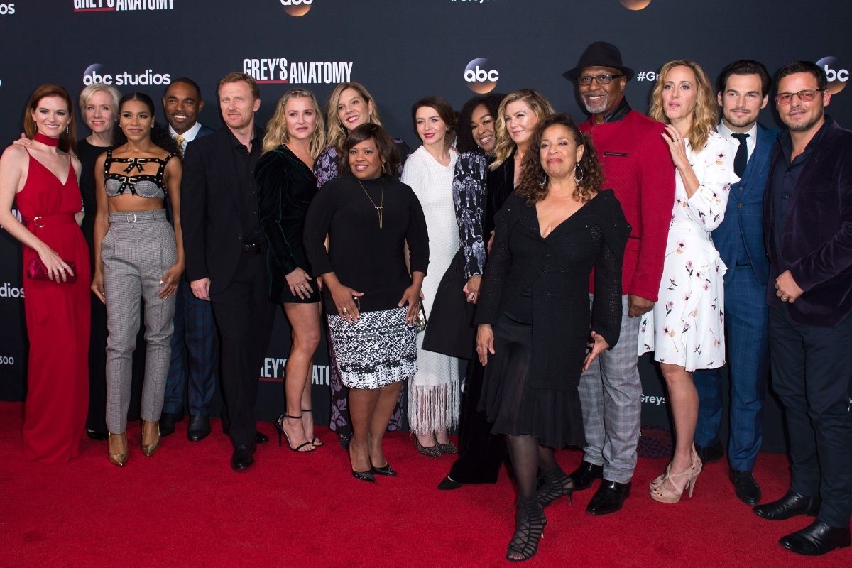 The cast of the ABC show, "Grey's Anatomy" on a red carpet including Black woman creator and writer, Shonda Rhimes.