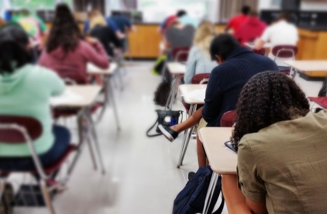 A photo of high school-age students in a classroom 