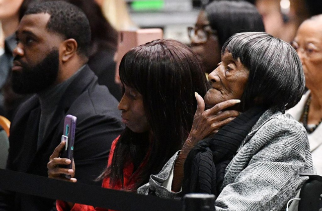 Tulsa race massacre survivor Lessie Benningfield Randle (R) listens as US President Joe Biden speaks during a commemoration of the 100th anniversary of the Tulsa Race Massacre