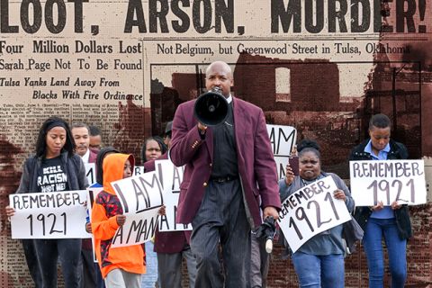 Dr. Robert Turner leads a group from the Vernon African Methodist Episcopal (AME) church to Tulsa City Hall, demanding “reparations now.”