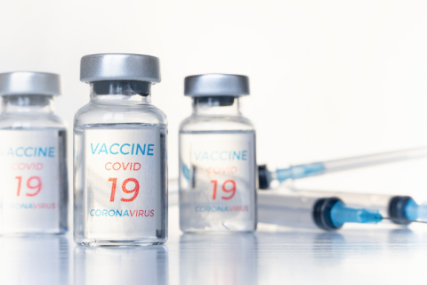 Transparent vials, syringes with new vaccine for covid-19 coronavirus, flu, infectious diseases.