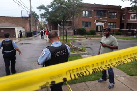 JULY 21: Police secure the scene of a shooting in the Auburn Gresham neighborhood on July 21, 2020 in Chicago, Illinois