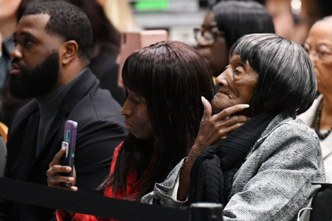 Tulsa race massacre survivor Lessie Benningfield Randle (R) listens as US President Joe Biden speaks during a commemoration of the 100th anniversary of the Tulsa Race Massacre